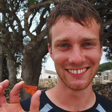 Student shows a fragment of early Christian lamp