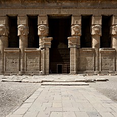 Facade of the Temple of Hathor at Dendera, with its Hathor-headed columns, built in the Ptolemaic and Roman periods.